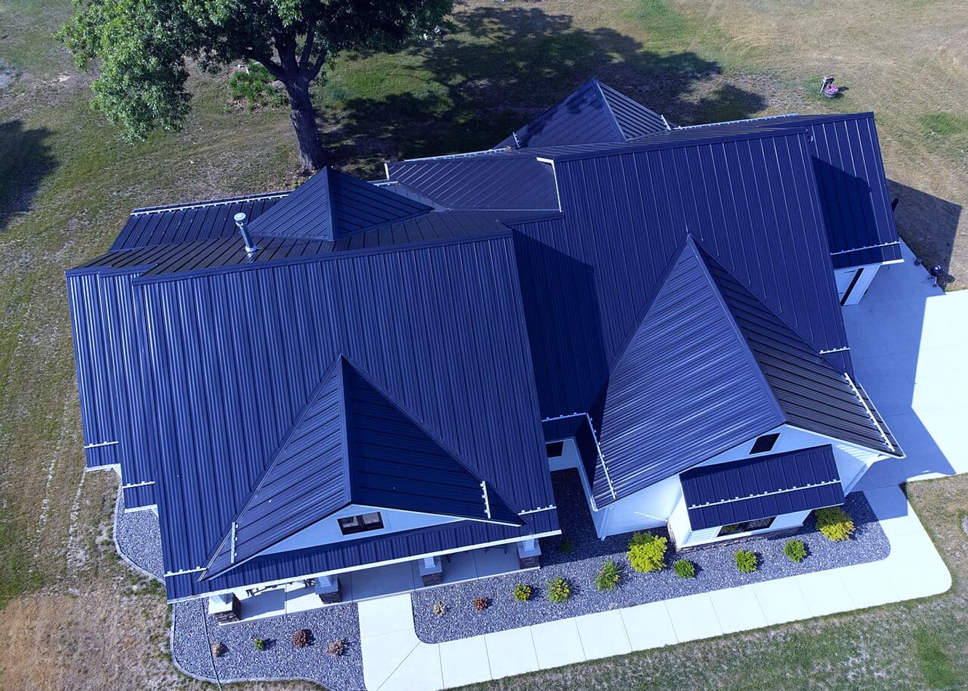 Standing-Seam Metal Roofing | Warm Home Inc Standing seam metal roof installed on a residential building